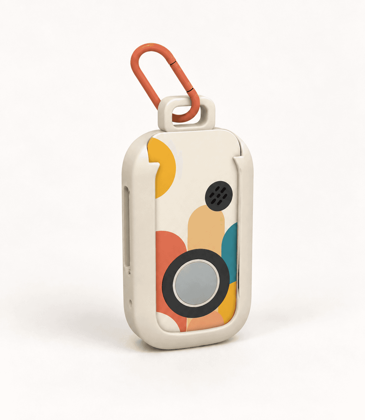 The Yado device: a small rounded rectangle with one large circular button on the front, two keys on the side, a speaker grille, and a carabiner clipped through the loop on top.